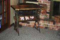 Recycled, old sewing machine legs, distressed wood, and inlaid sublimated tiles come together t